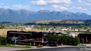 luxury RV resorts - RVs parked in front of a mountain view 