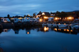 Beachfront luxury RV resorts - Camping in the evening lights in Norway. Norway is officially the Kingdom of Norway, is a Nordic country in Northwestern Europe whose core territory comprises the western and northernmost portion of the Scandinavian Peninsula with total area of 385,252 square kilometres and a population of 5,312,300.