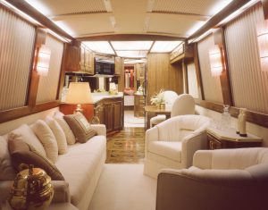 right RV furniture This image is a 40' luxury bus motor home interior view looking from the front to rear.