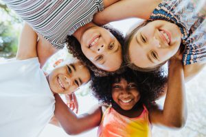 roadschooling - Group of children smiling and looking at the camera