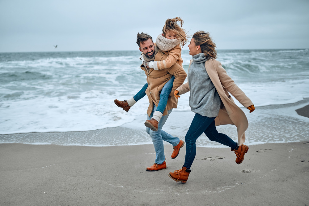 Family on the beach in the winter