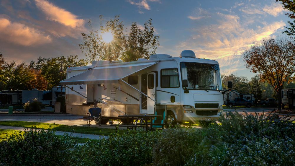 Class A motorhome parked at a campsite.