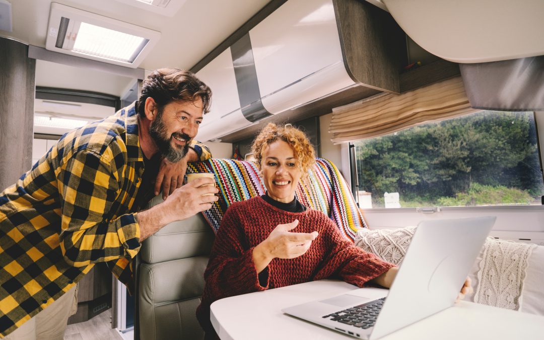 On couple on computer in Motorhome