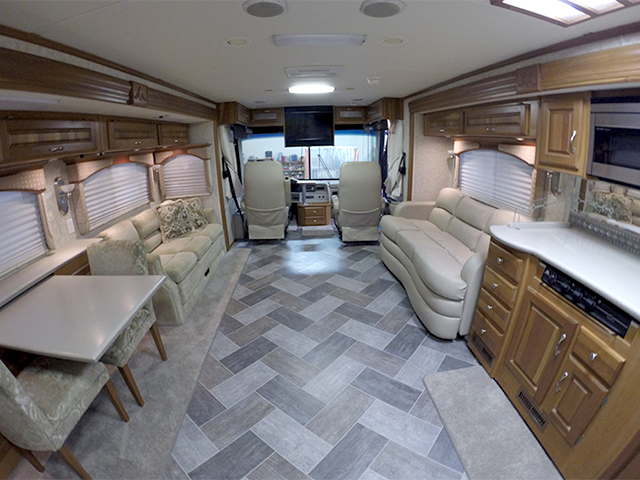 A completed RV flooring installation done by Bradd and Hall. Shows both tile and carpet work. 