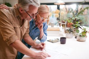 Couple signing insurance policy